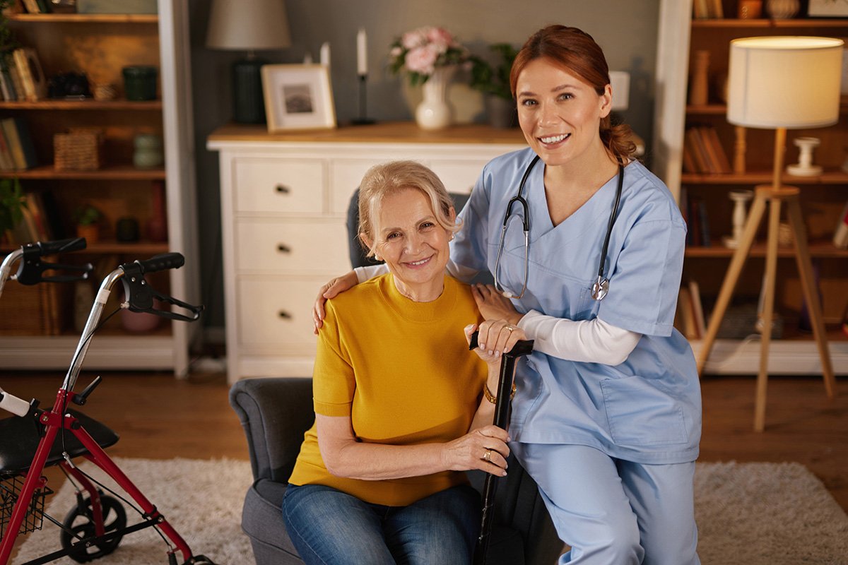 medical professional supports an elderly woman